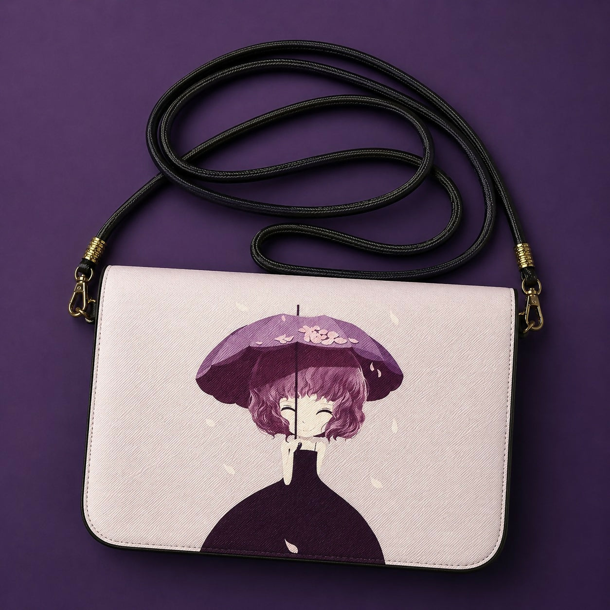 Purple cartoon print mini crossbody bag showing strap detail