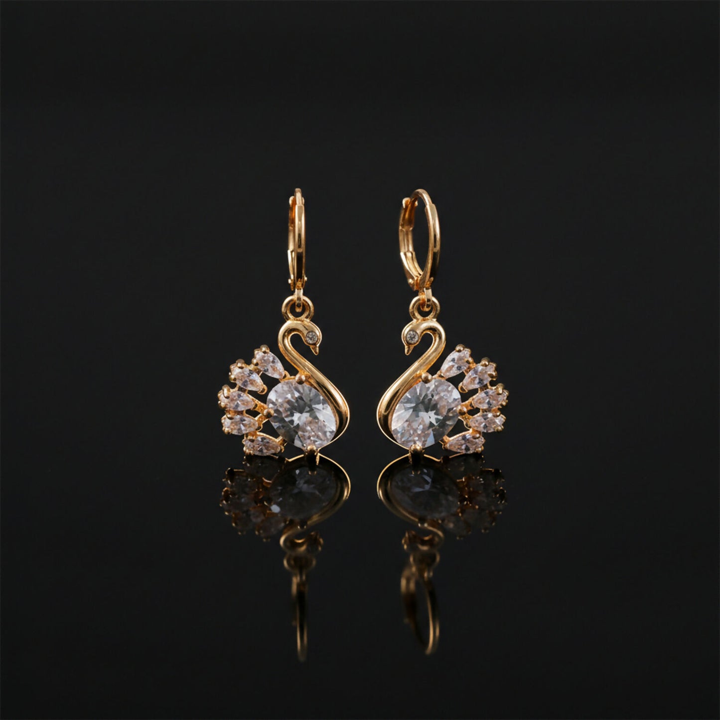 Stylish swan motif drop earrings featuring sparkling clear stones and hanging style