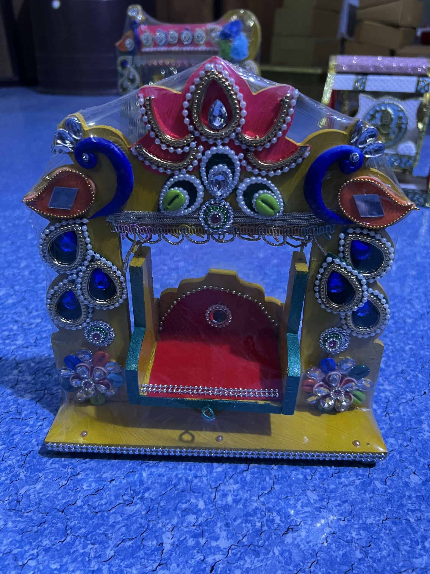 Wooden Laddu Gopal Jhula swing displayed for pooja setup