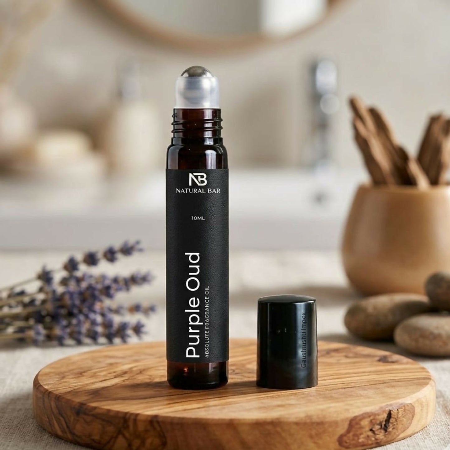 Purple oud luxury attar roll-on with elegant packaging