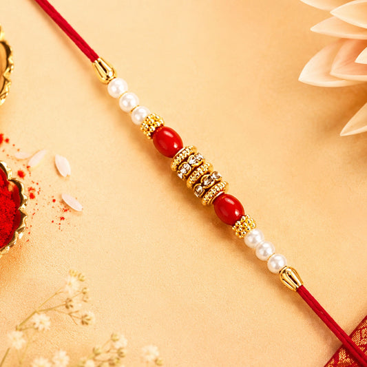 Traditional Pearl & Red Beaded Rakhi with Golden Accents (1 Pc)
