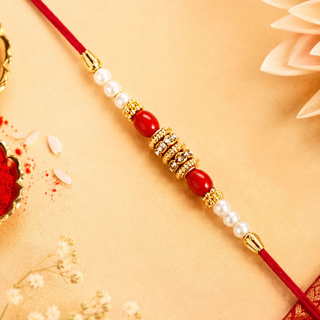 Pearl Beaded Rakhi – Traditional Red & Gold Elegance