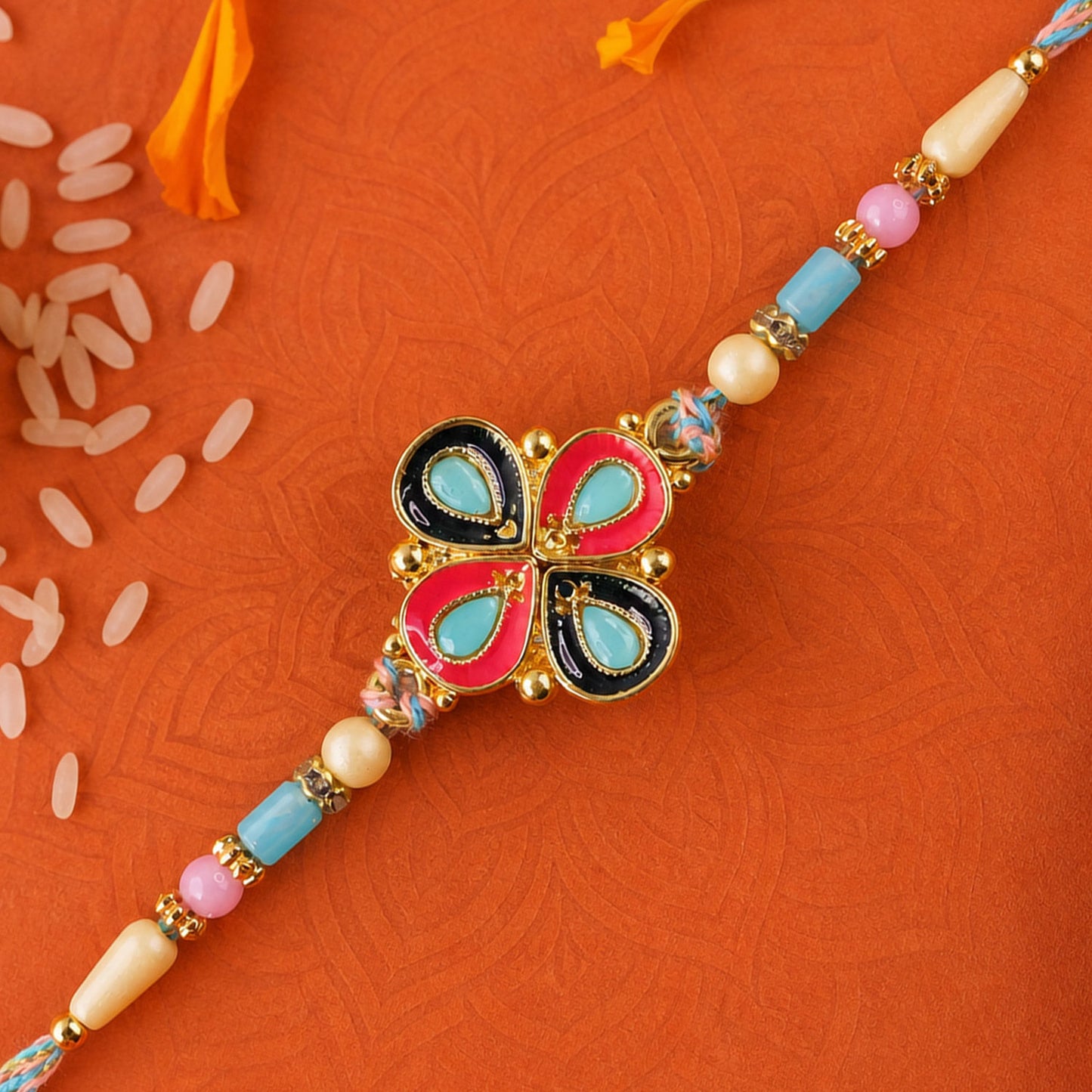Four-Petal Floral Rakhi with Cream Thread, Multicolor Enamel and Floral Motif Design
