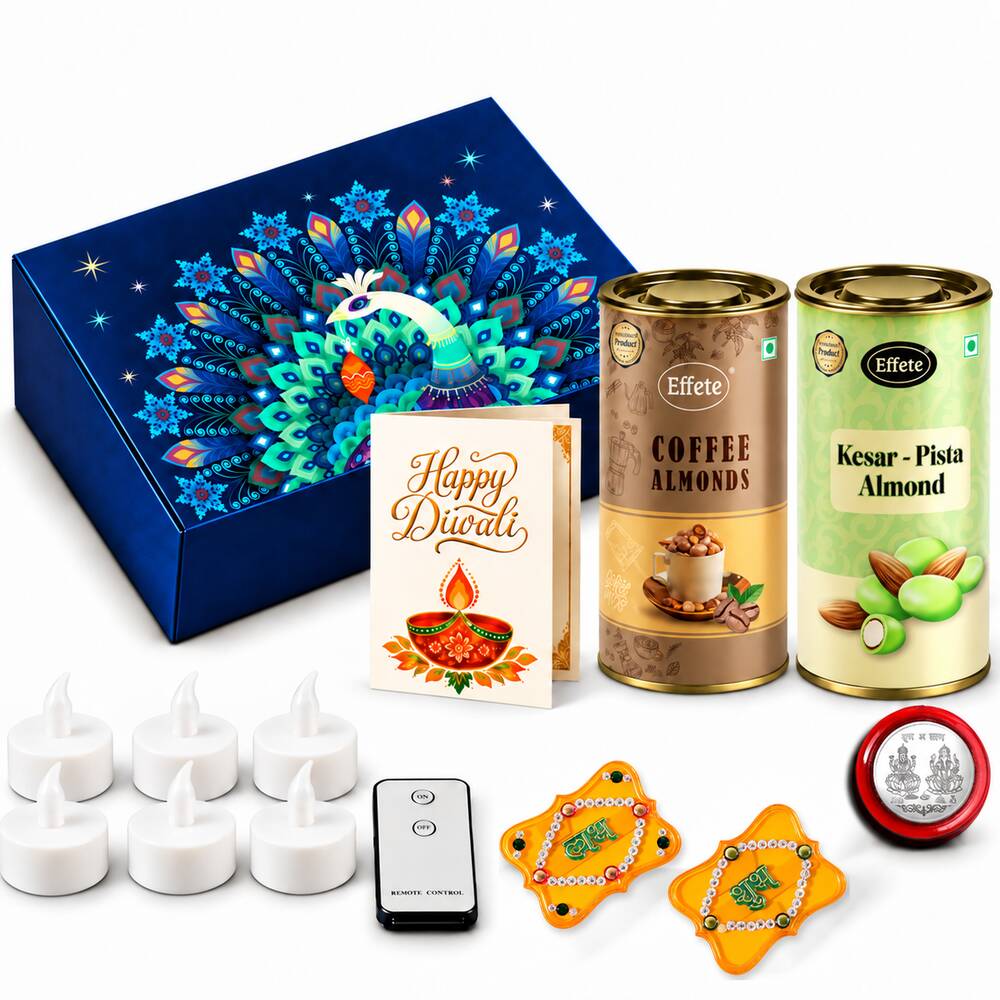 A blue box with a peacock design, two almond tins, a Diwali card, six LED tealights, a remote, two yellow Shubh Labh