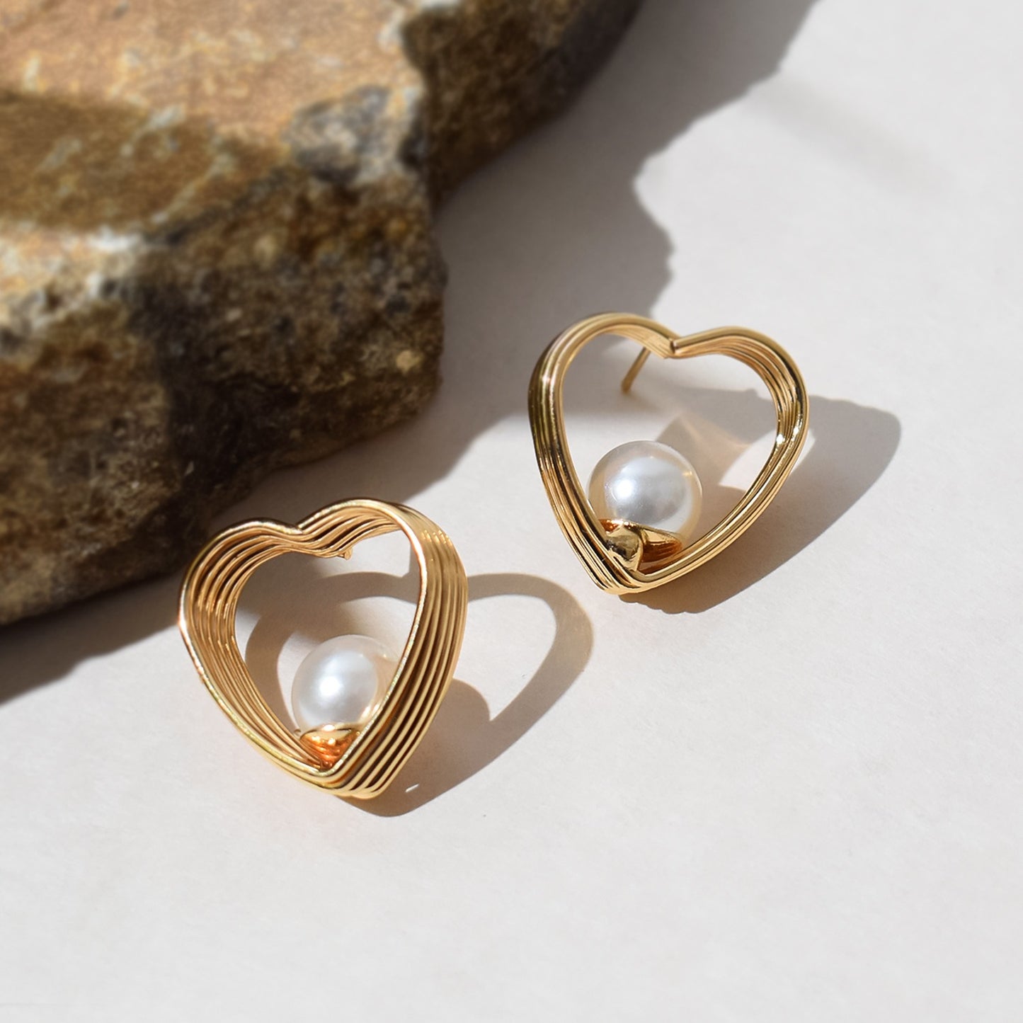 Collection of diverse sparkling earring set from HV, featuring various stud and hoop designs.