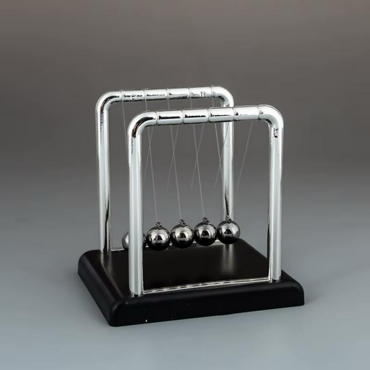 Newton Cradle desk toy with metal balls in motion