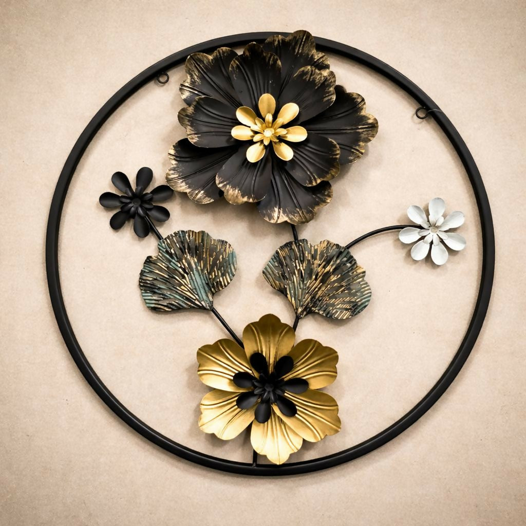 Close-up of black and gold flower details on metal wall art