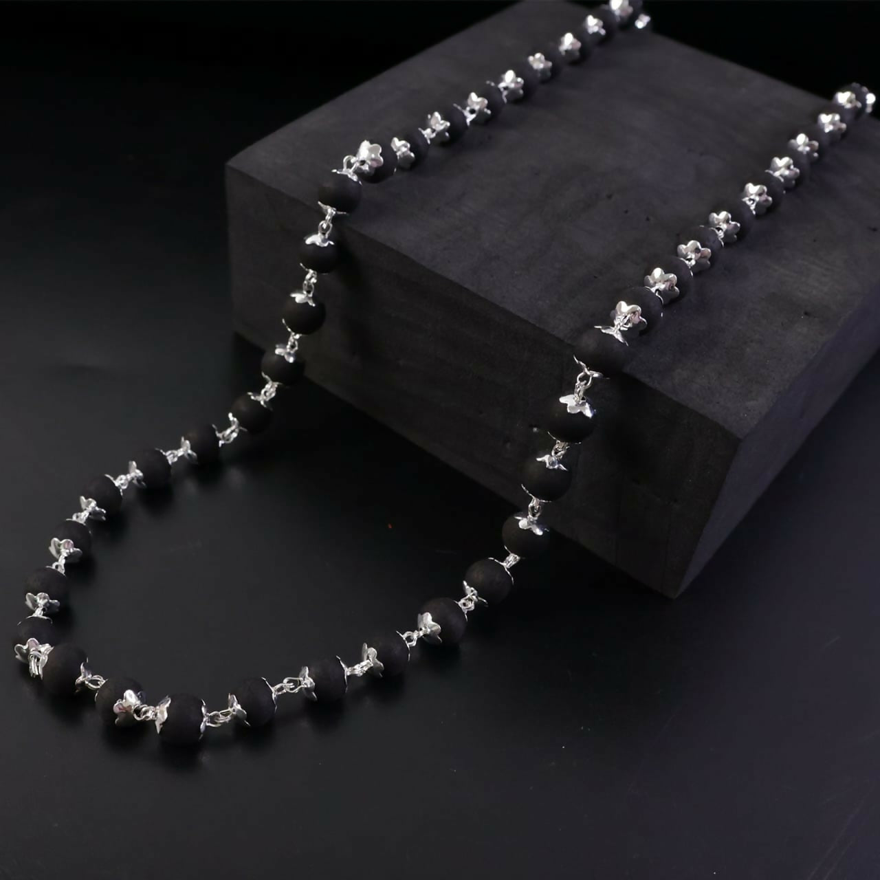 Karungali necklace styled with elegant outfit