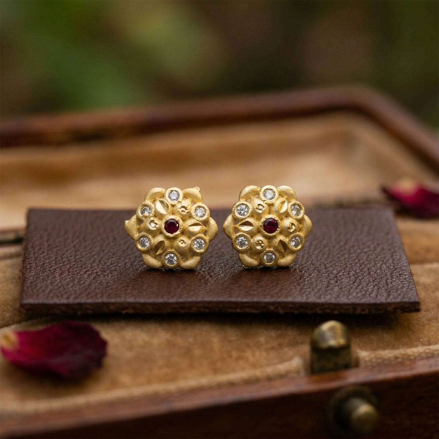 Jewellery featuring intricate gold and crystal triangle pattern