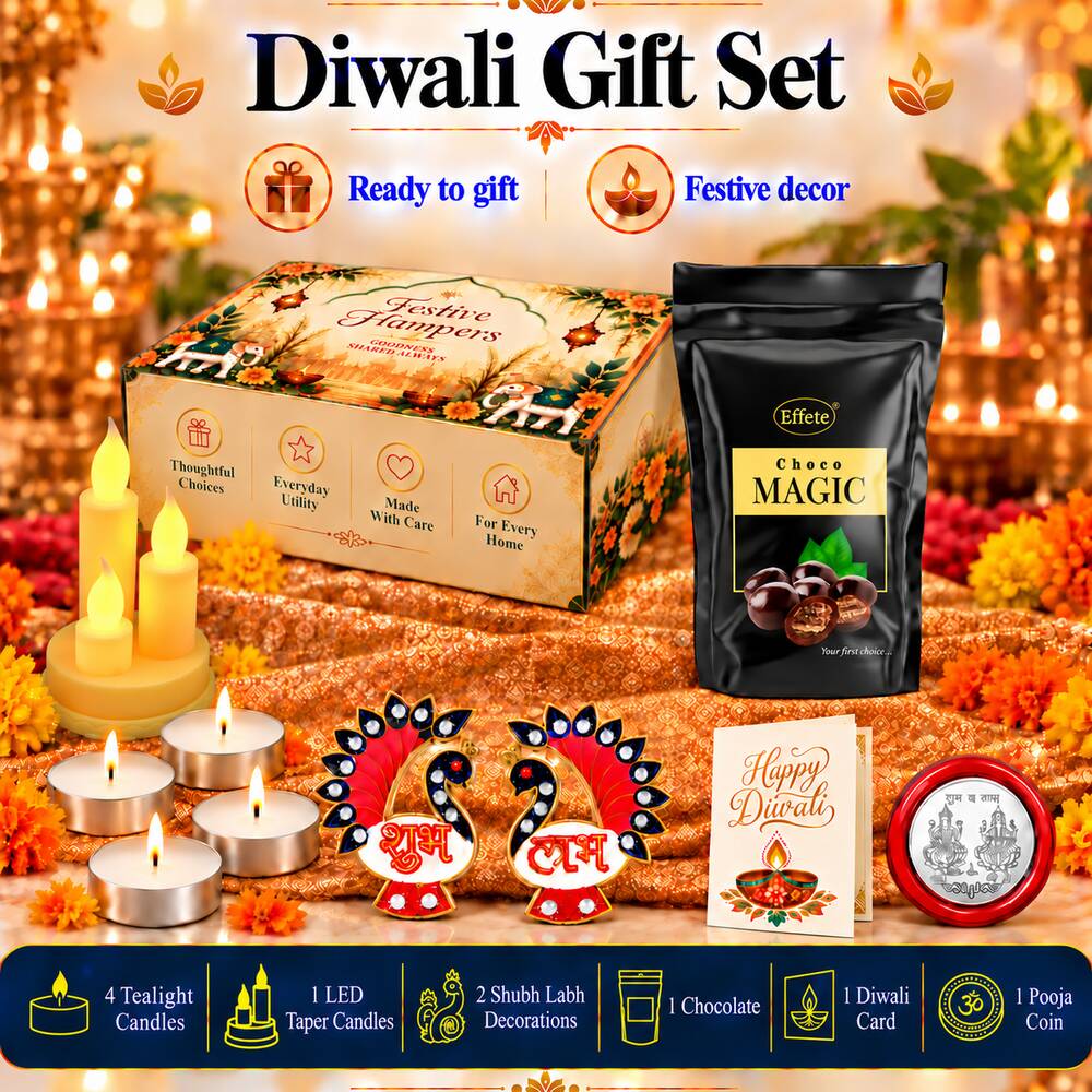 A Diwali gift set with chocolate, LED candles, tealights, peacock decor, a silver coin, and a greeting card on a festive
