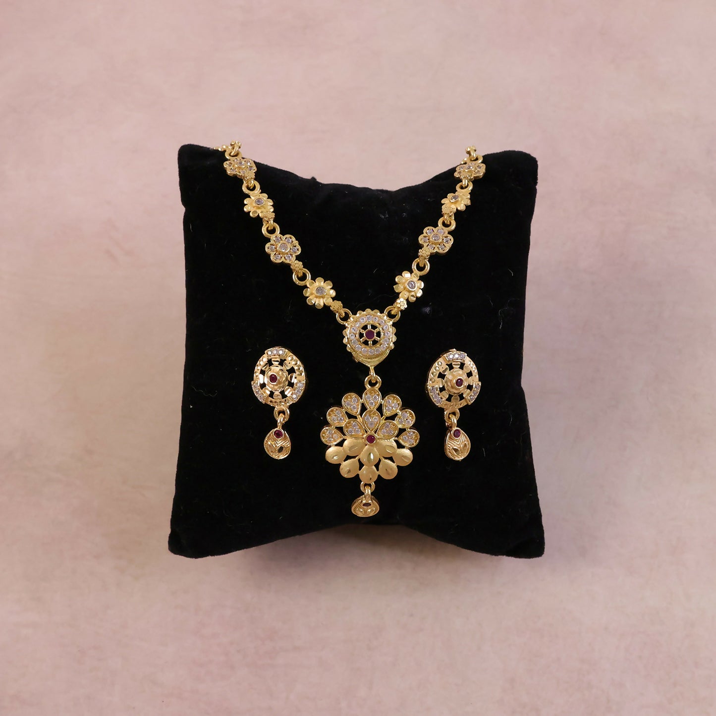 Side view showing lightweight design of gold-tone floral necklace set