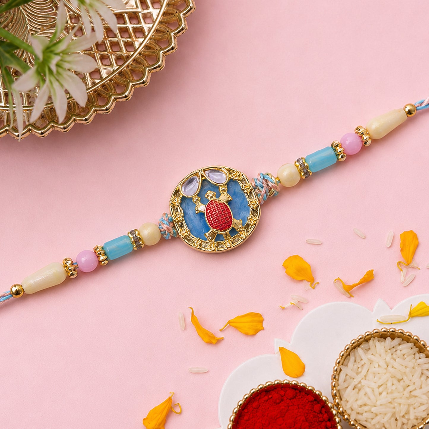 Elegant Blue Designer Rakhi for Brother with Golden Pendant & Premium Bead Work