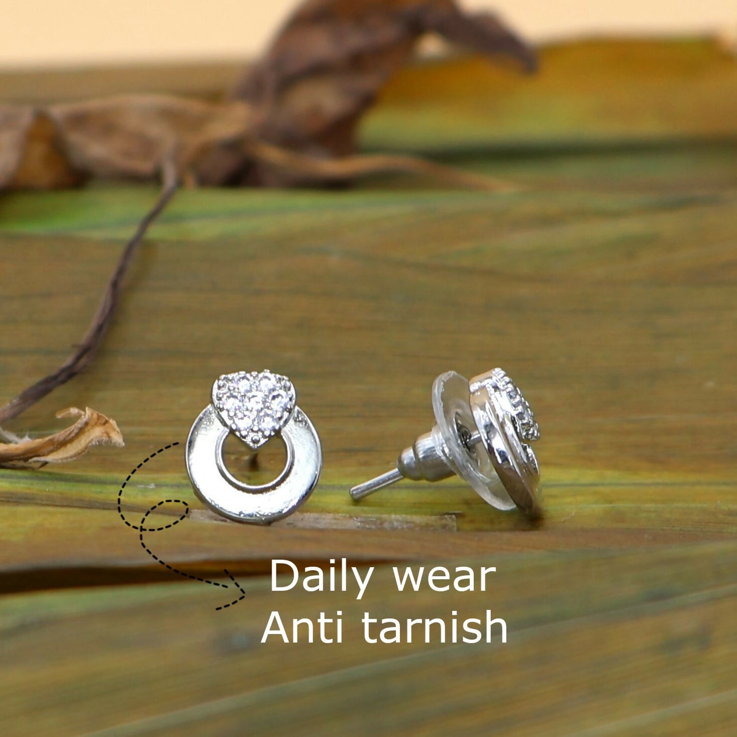 Elegant silver tone heart stud earrings designed for women and girls