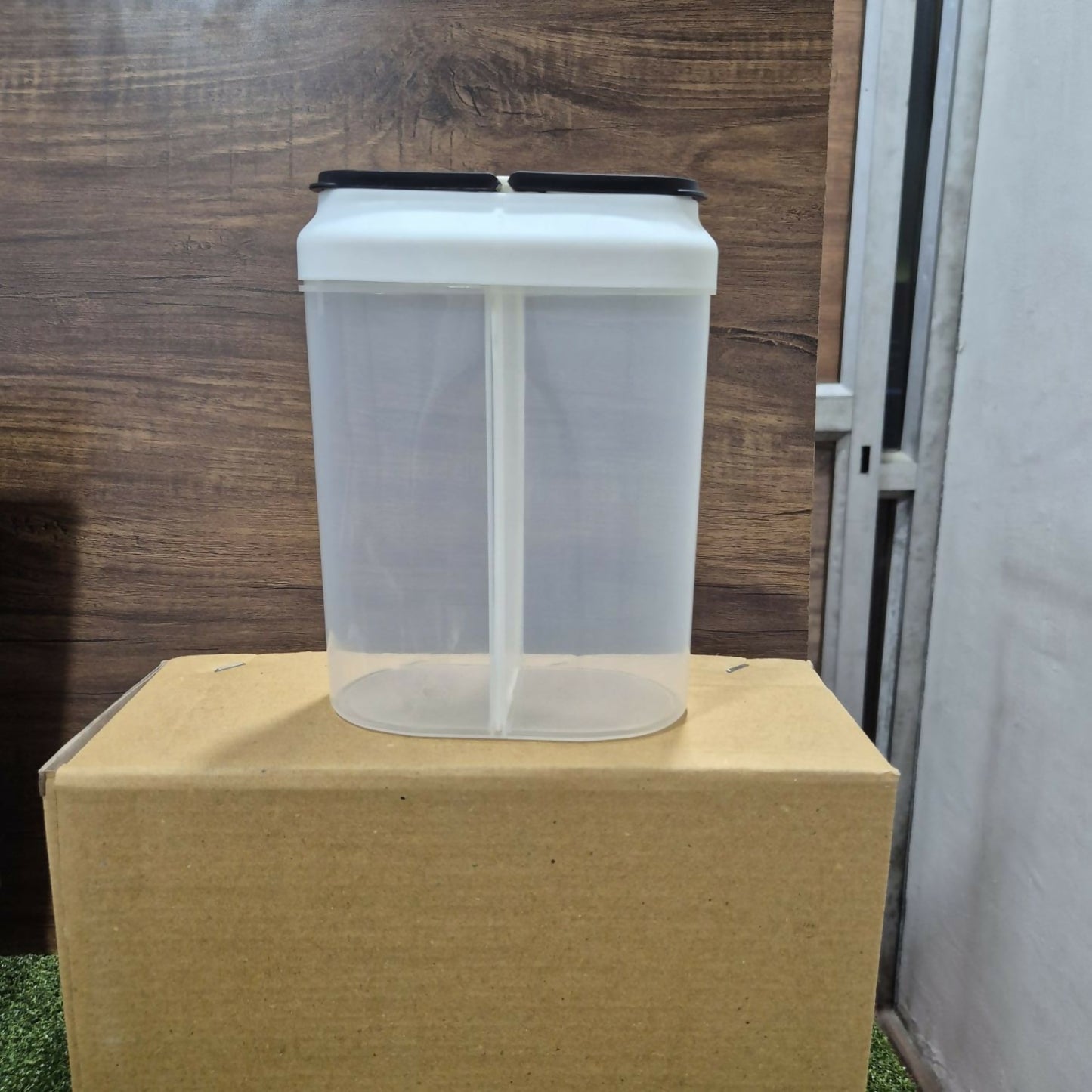Clear dual compartment container showing internal divider & capacity