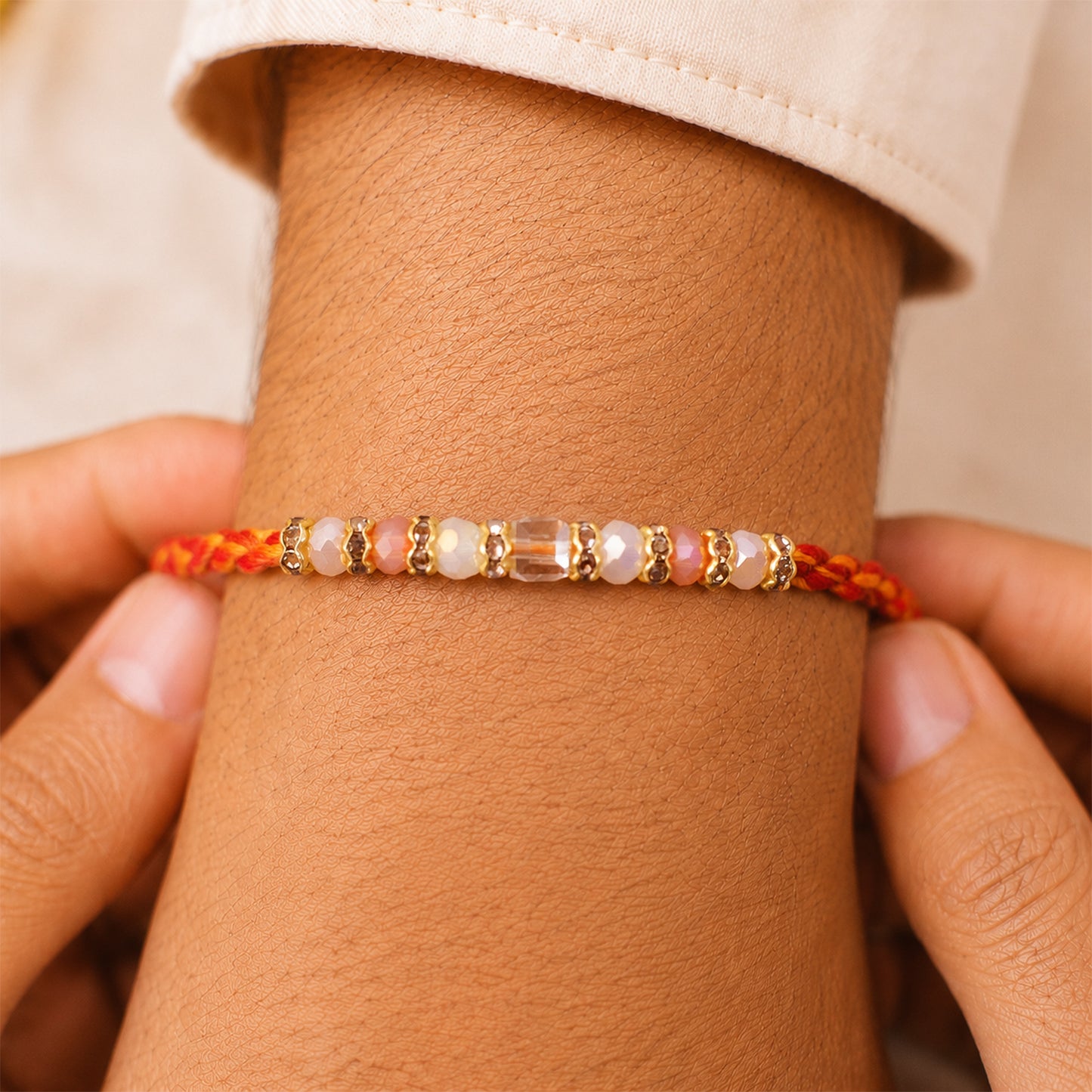 Silver Tone Designer Rakhi with Pastel Beads and Elegant Bracelet Style Finish