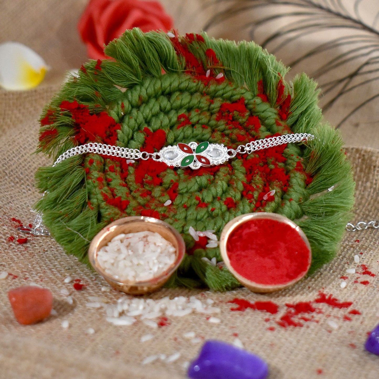 Close-up of Elegant Floral Rakhi with enamel work and metal chain