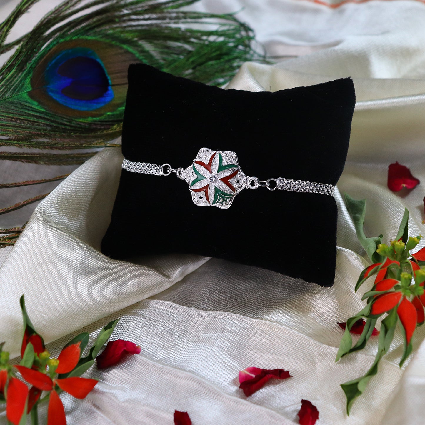 Elegant Flower Rakhi featuring a detailed silver chain design for Raksha Bandhan.