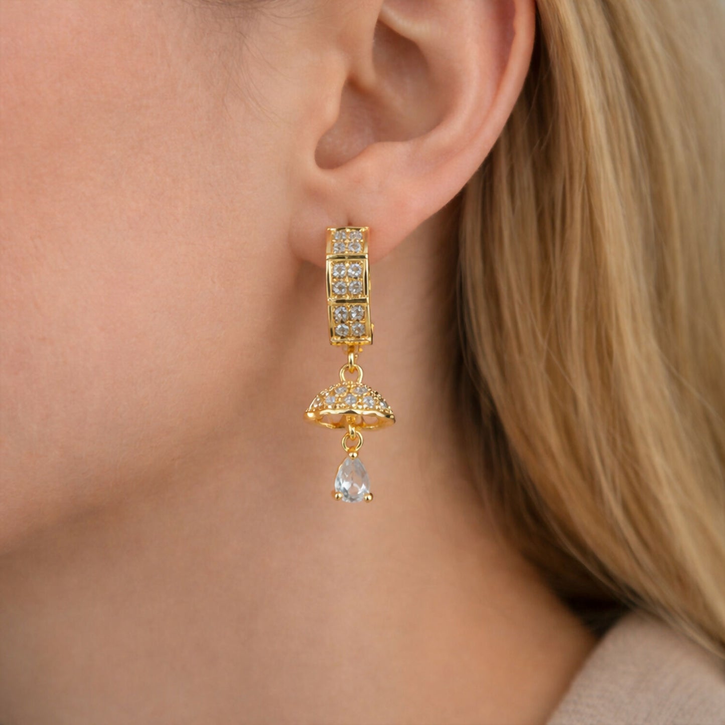 Detailed dome-shaped charm on gold-tone crystal drop earrings for women