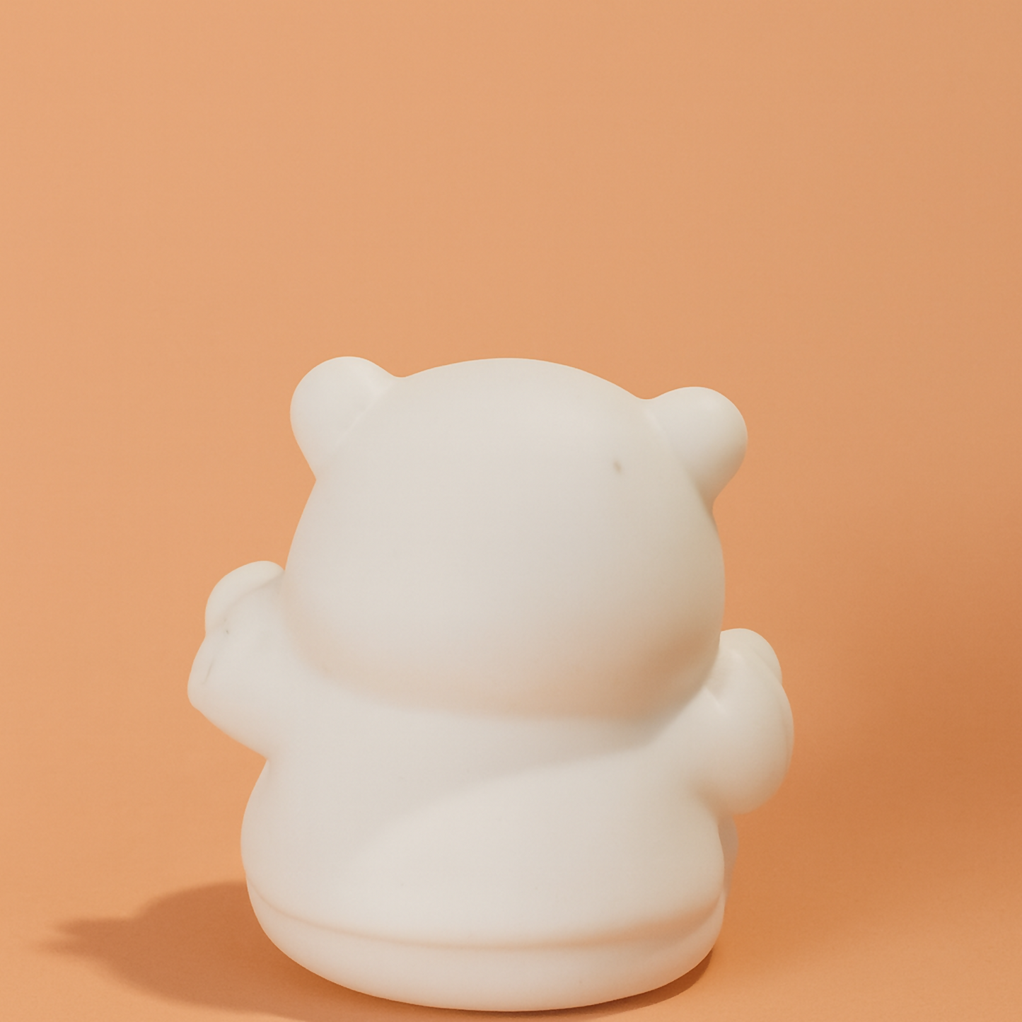 Mini panda figurine with blush cheeks front view