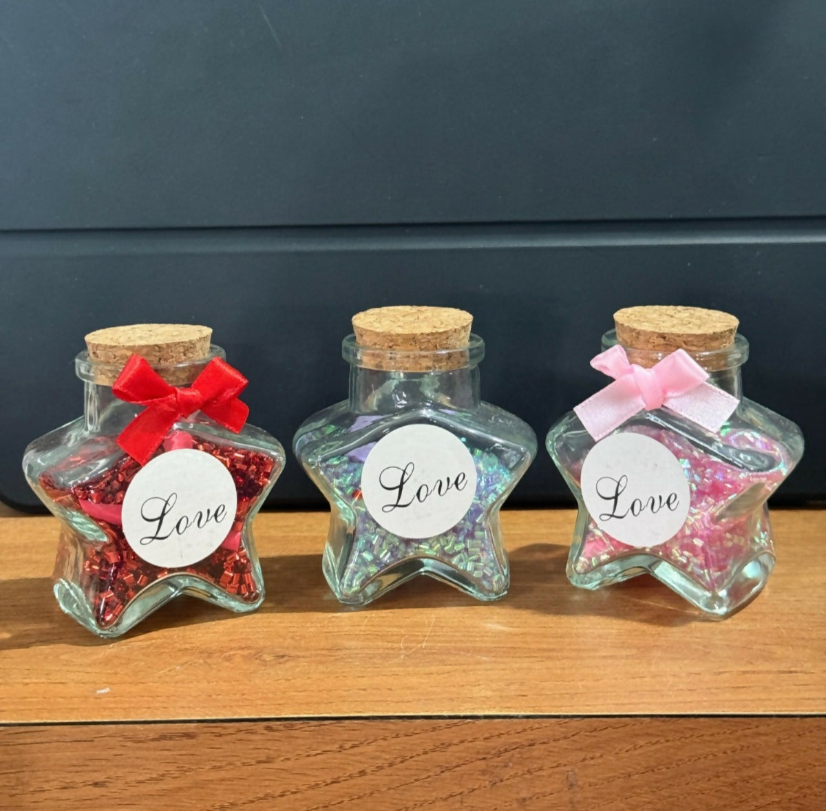 Star Shaped Glass Love Jar Bottles with Cork Lid and Decorative Ribbon – Set of 3 (Red, Blue & Pink) | Cute Romantic Gift Bottles for Valentine’s Day, Anniversary, Birthday, Home Decor | Glitter Filled Mini Message Bottles