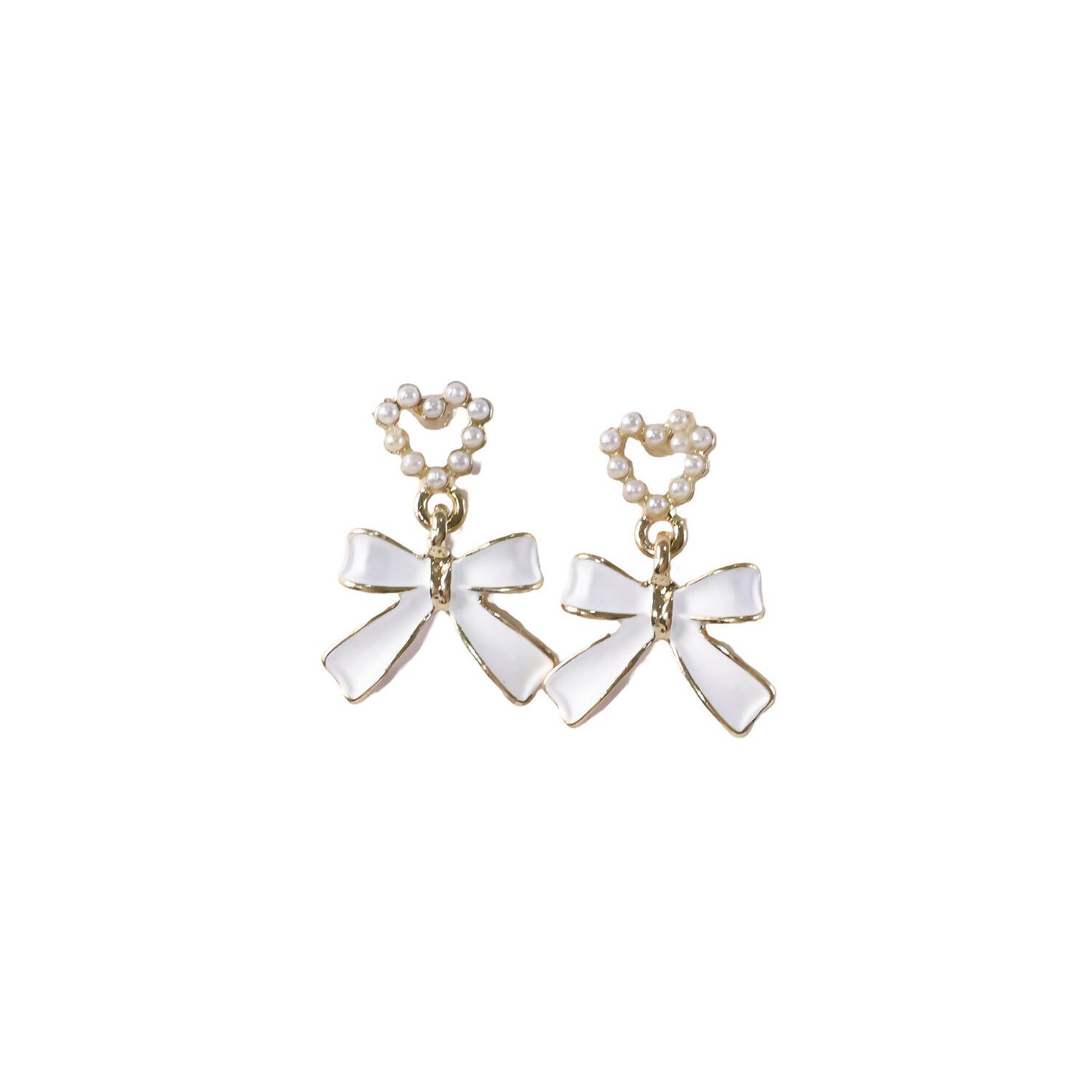 Close-up detailing of gold trim on pearl heart earrings
