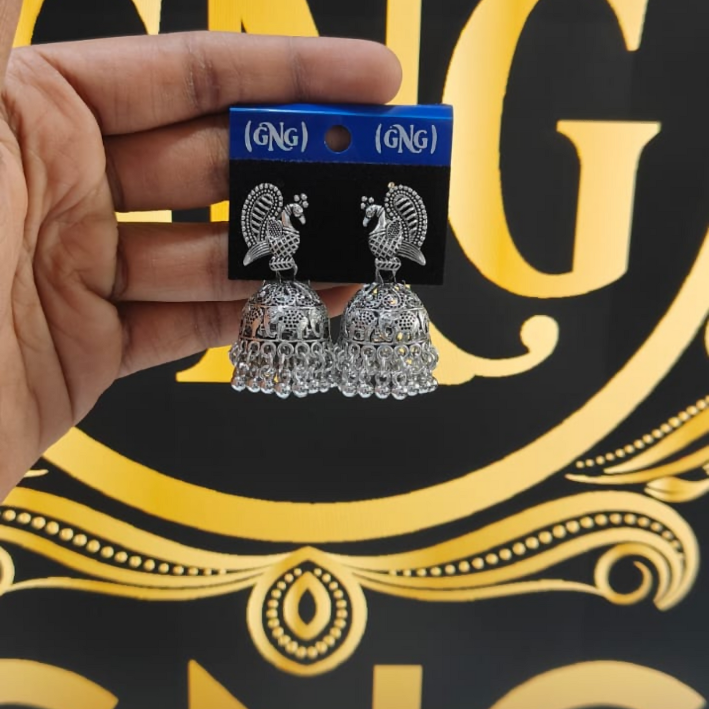 Pair of elegant silver peacock jhumka earrings with lightweight design