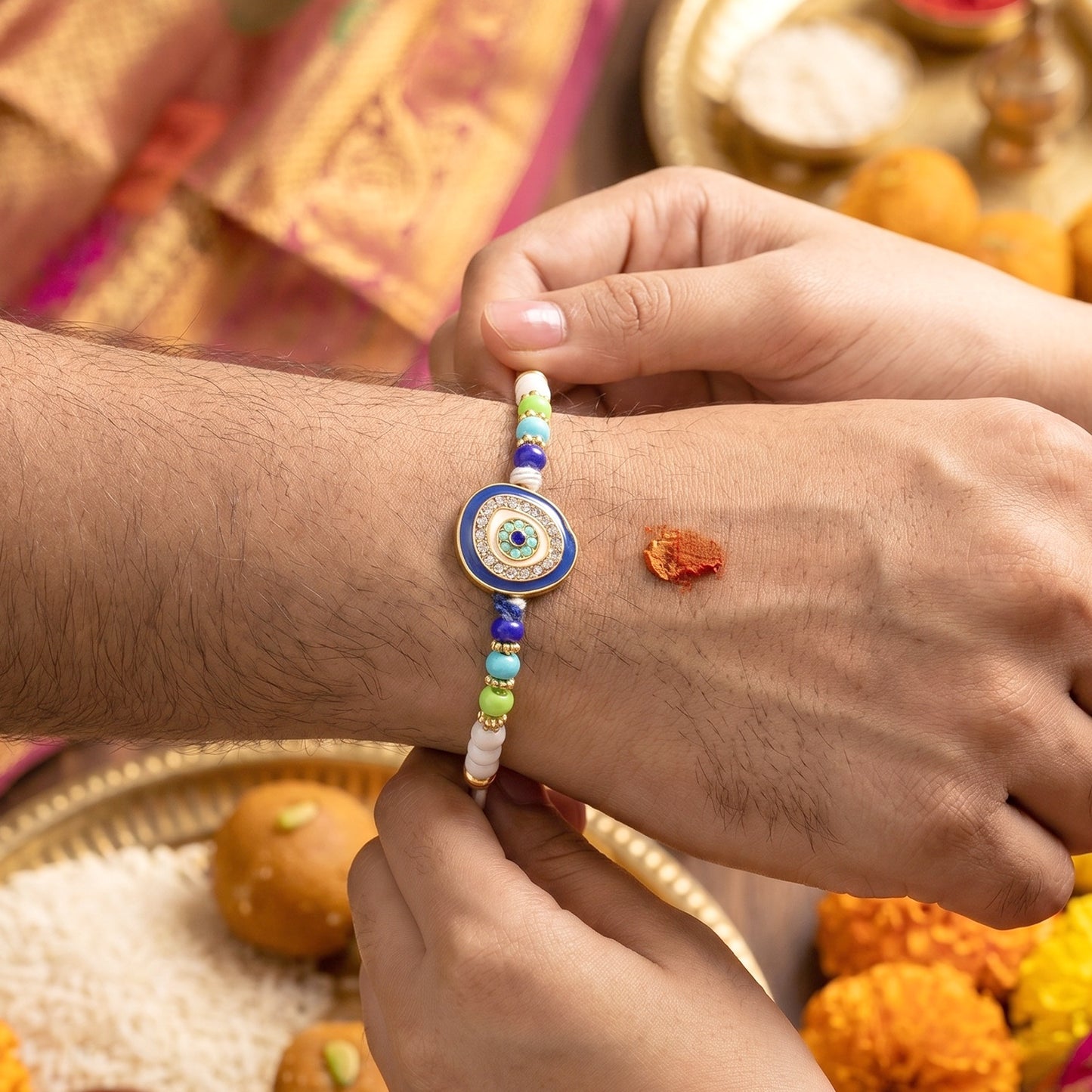 Traditional decorative beads on Rakhi thread