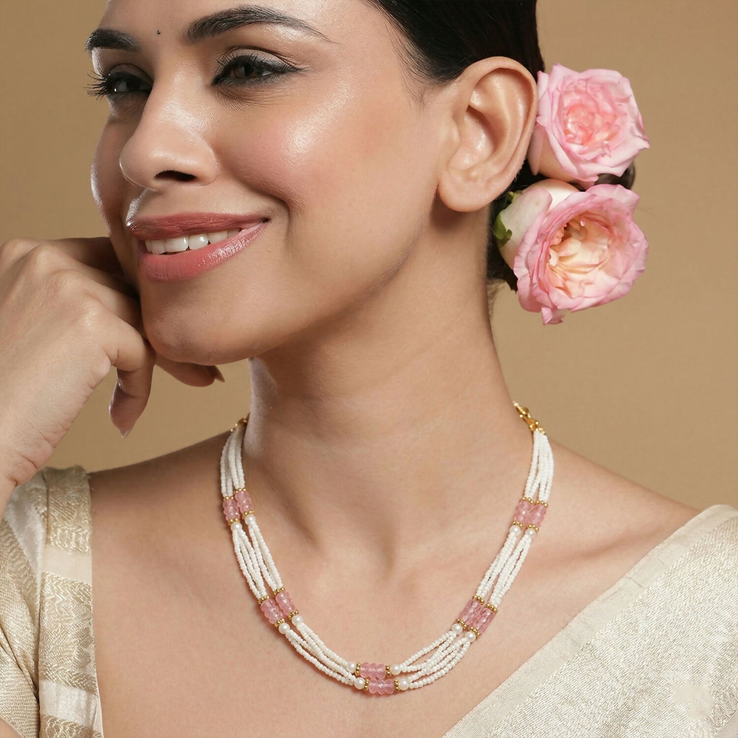 Layered strands of pearl beaded mala necklace with pink accents
