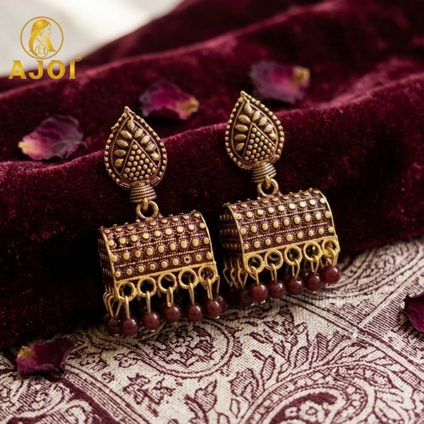 Antique Gold-Plated Leaf Design Jhumka Earrings with Maroon Bead Drops
