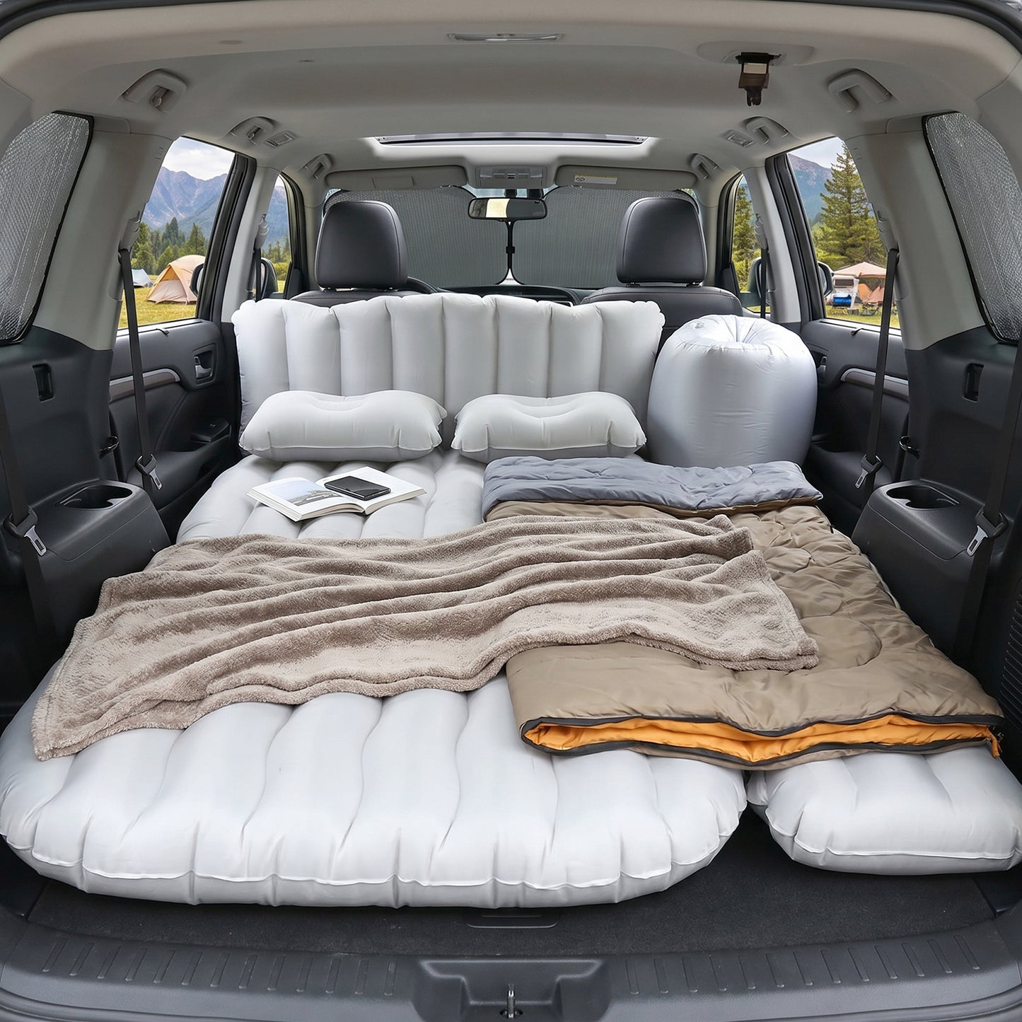 Inflatable car mattress laid out inside vehicle