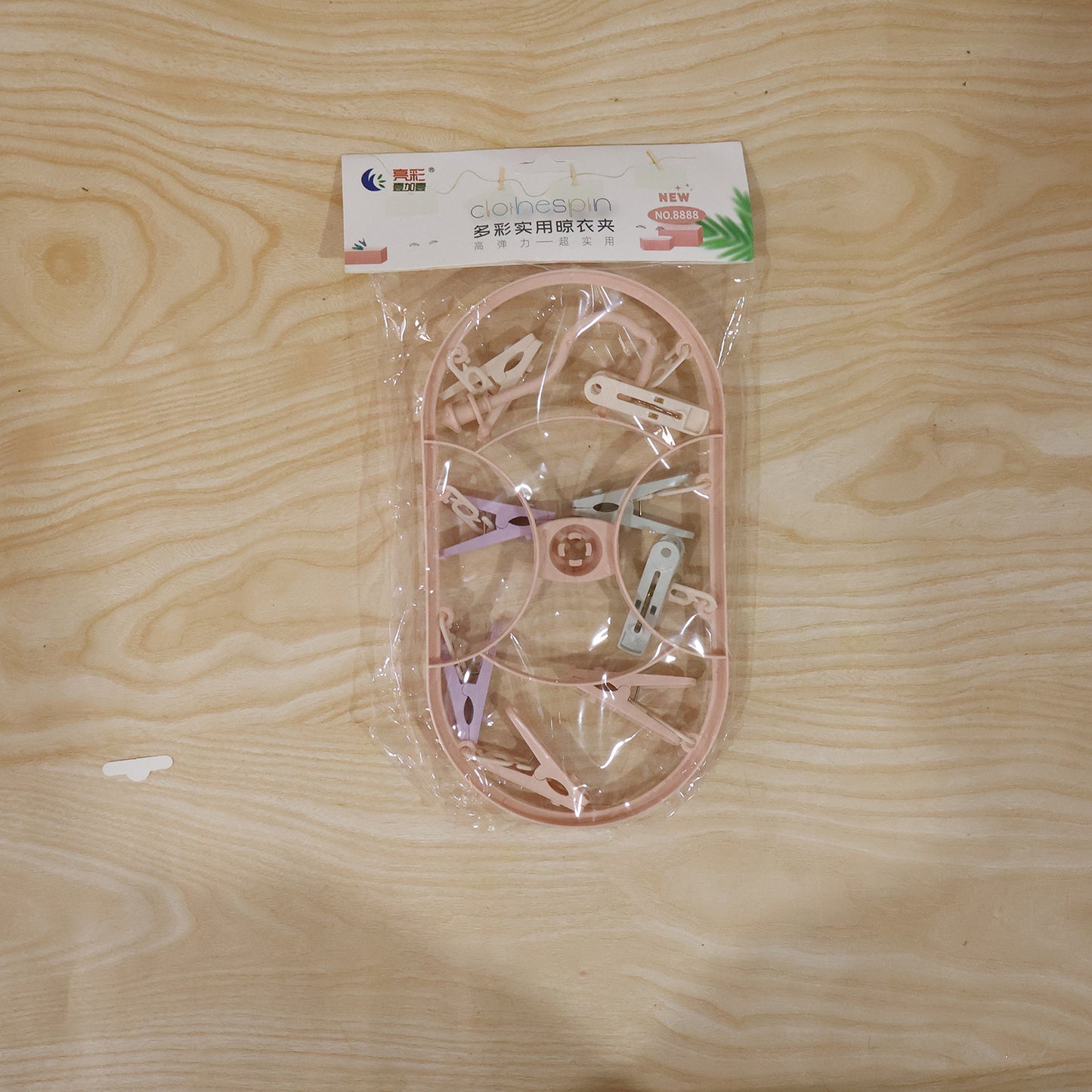 Packaging image of set of multipurpose plastic hanger clips ready for household use