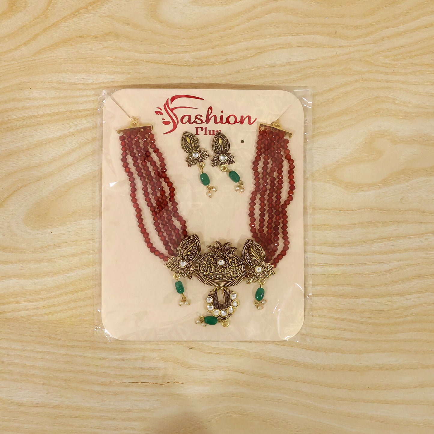 Full maroon beaded necklace and earrings set display