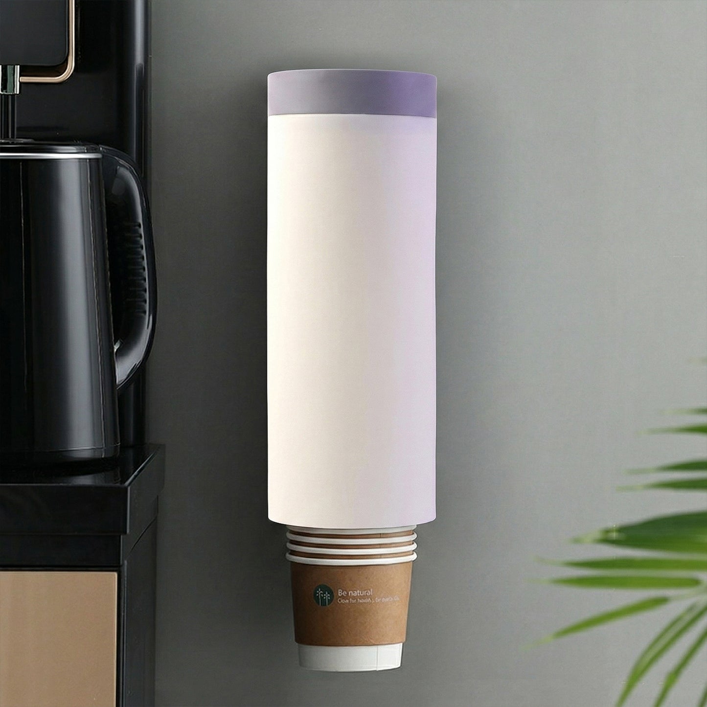 Cup dispenser mounted on wall holding paper cups