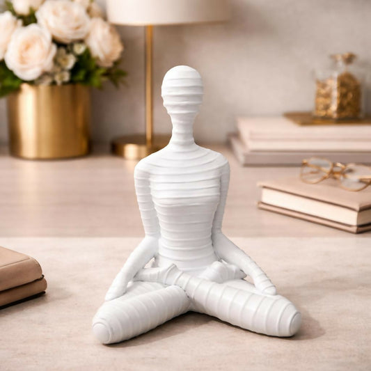 Serene meditation yoga human sculpture featuring a seated posture for mindfulness and relaxation