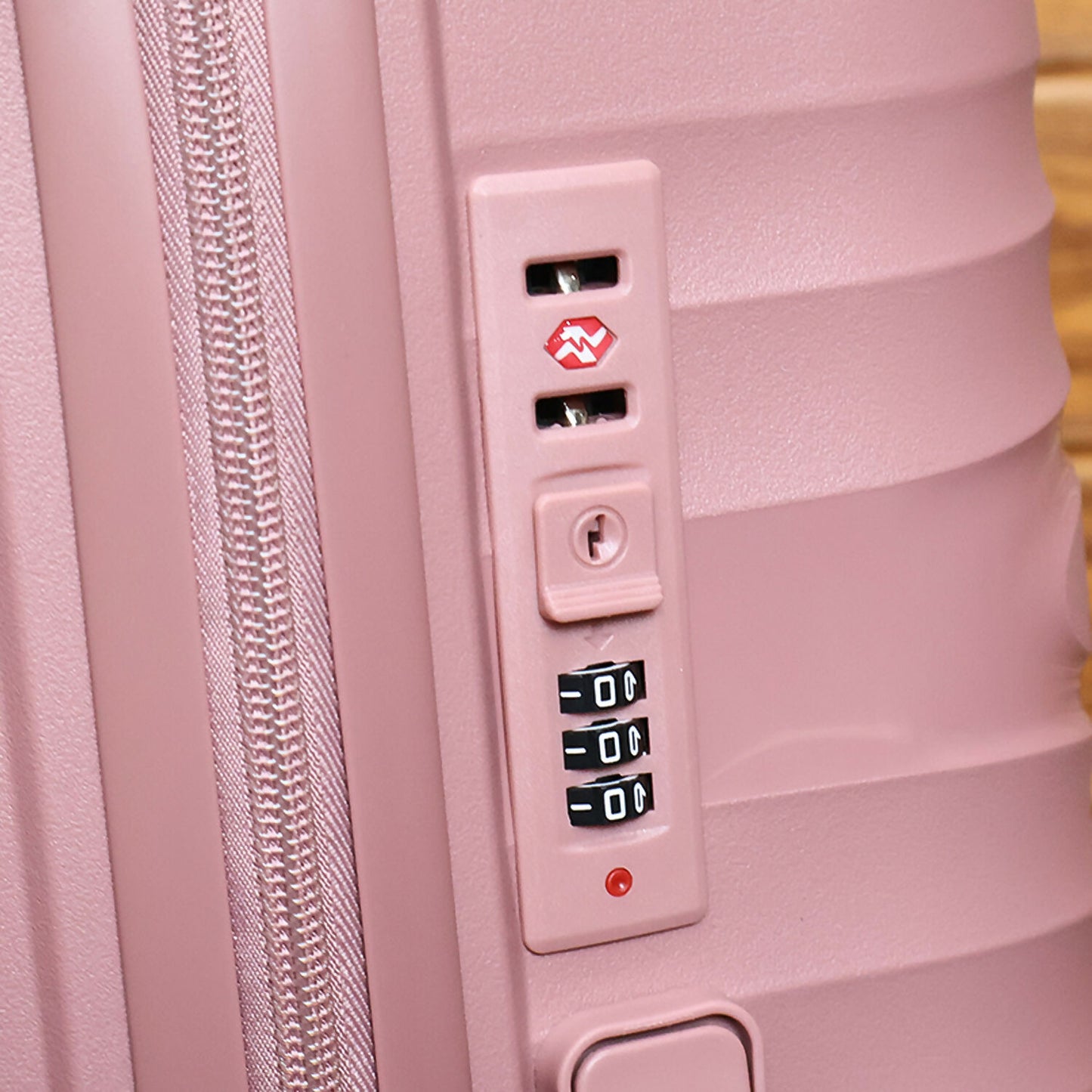Eight multi-directional wheels for smooth mobility on rose gold cabin suitcase