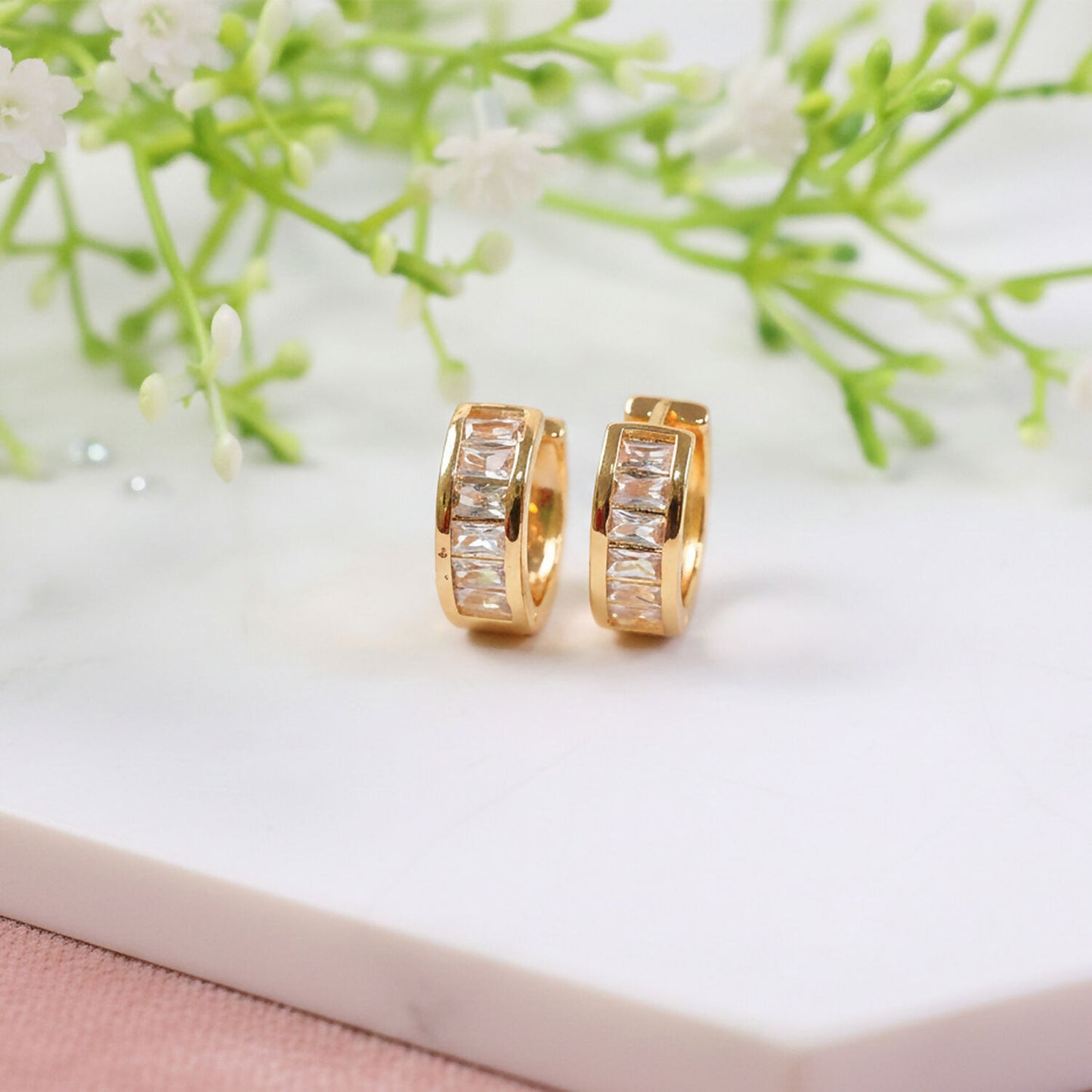 Close-up of gold hoop earrings featuring Cz stone embellishments for women and girls