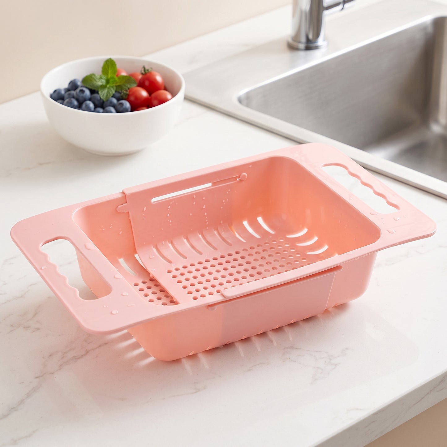 Colander resting over the sink draining washed vegetables