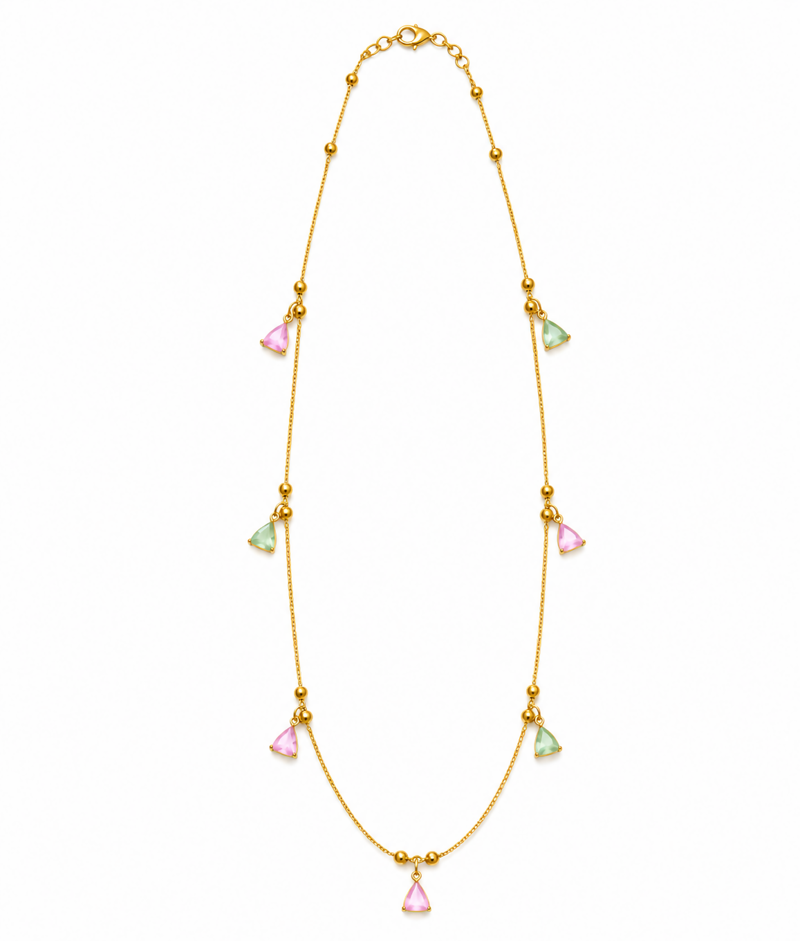 A gold-plated necklace with pink and mint green triangular charms is laid flat against a clean white background.