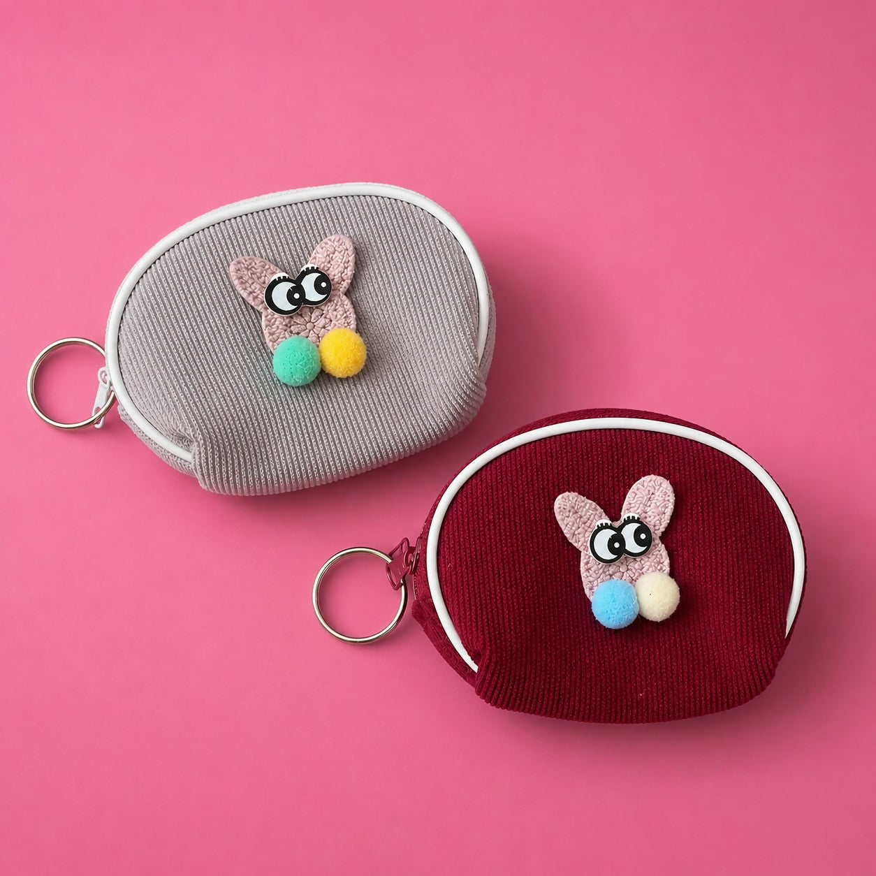 Mini coin pouch showing keyring attachment