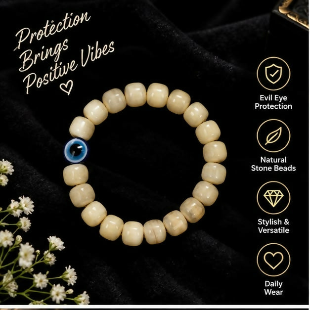 Cream barrel bead bracelet with contrasting blue evil eye