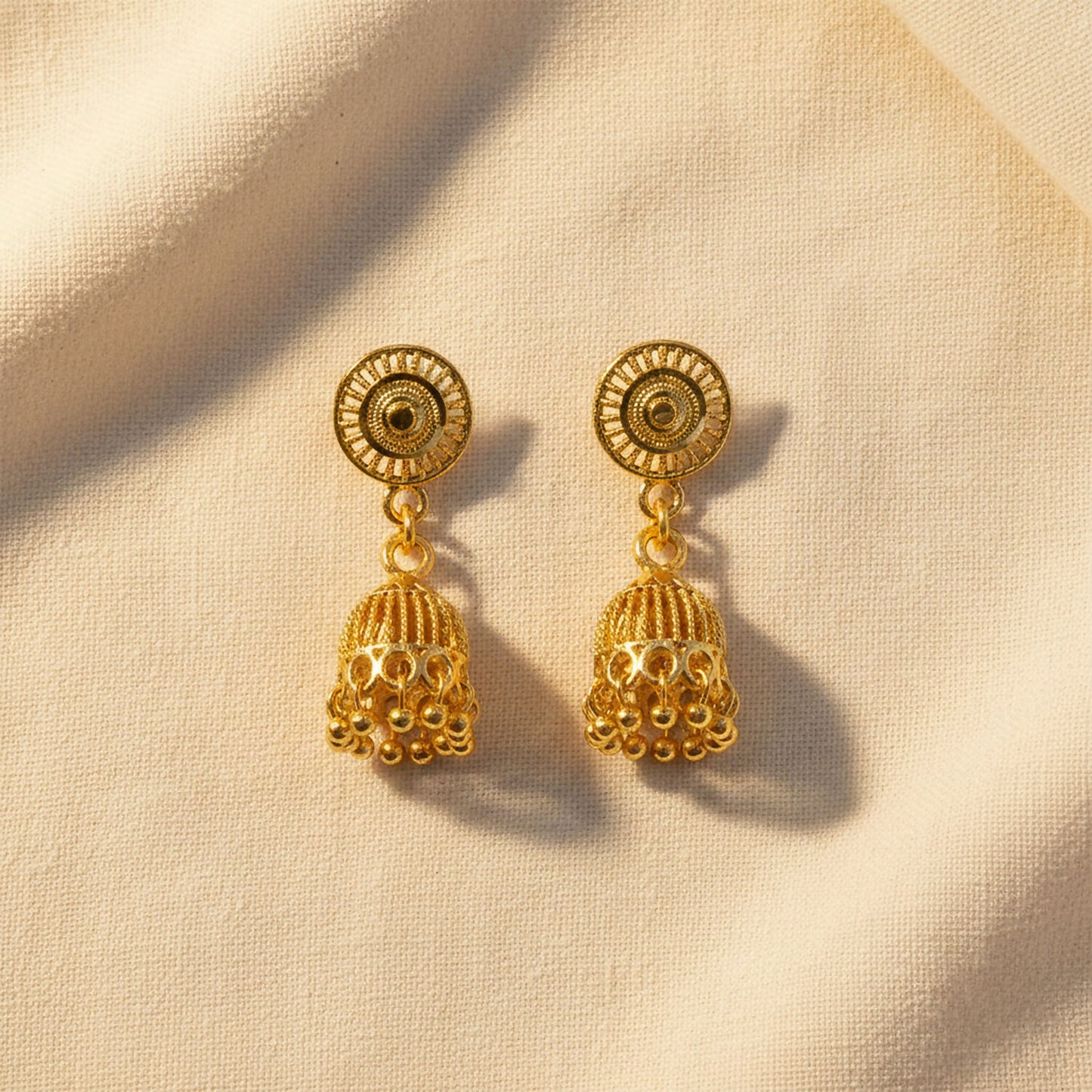 Traditional gold plated jhumka earrings from side angle