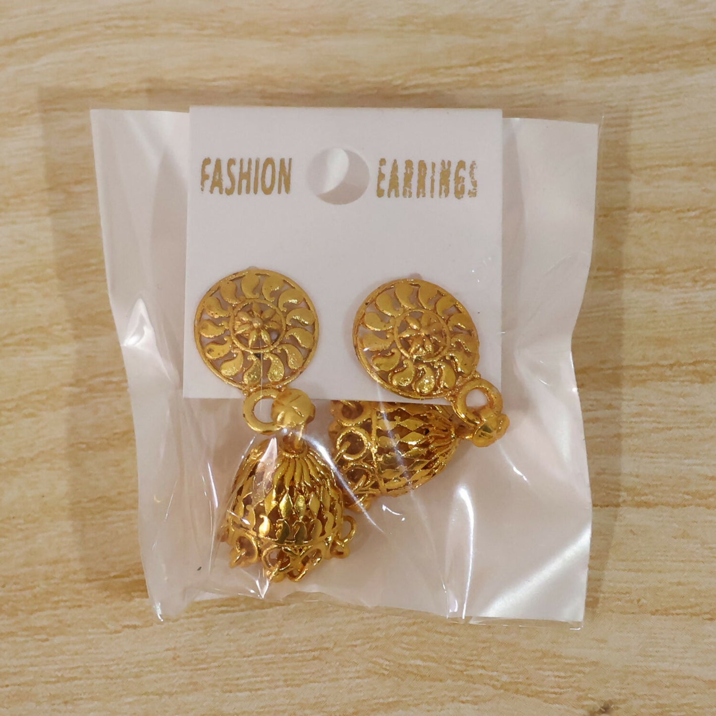 Elegant gold jhumka earrings with pearls perfect for festive occasions