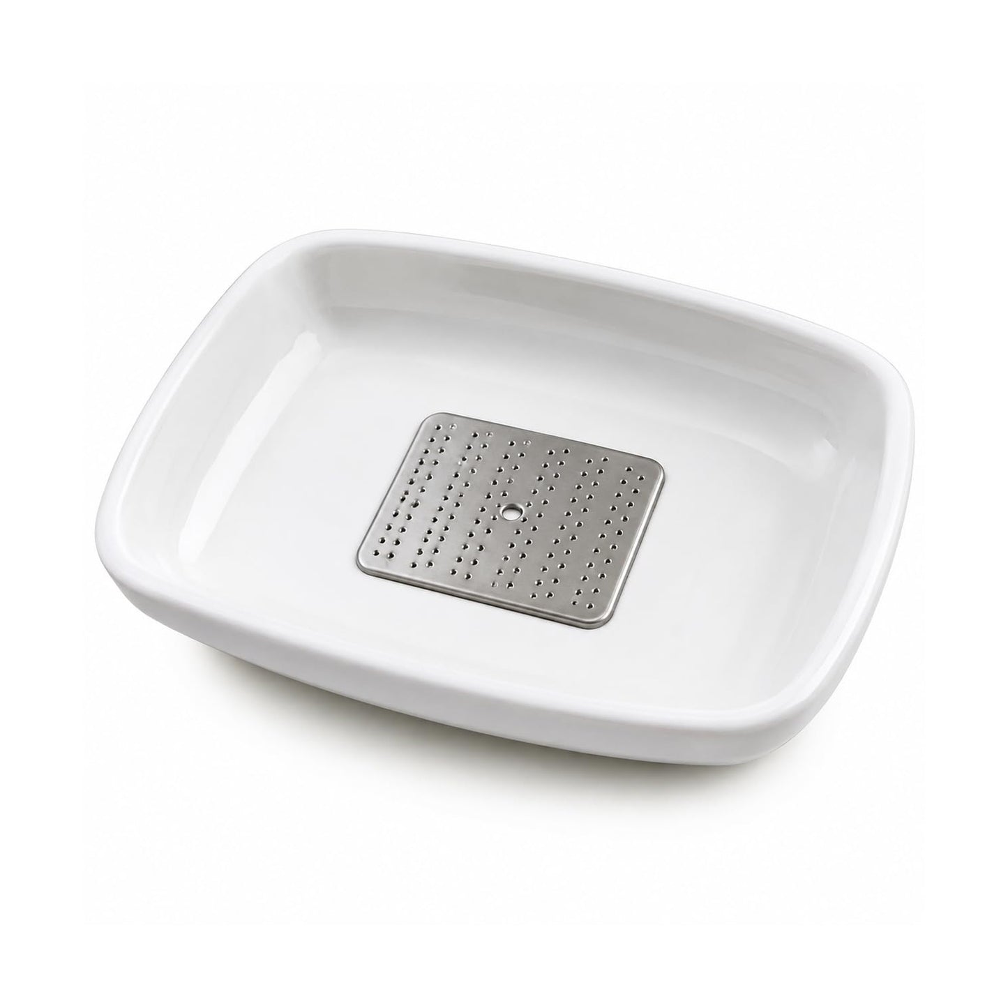 The garlic ginger grater plate in use, grating ginger over a dish