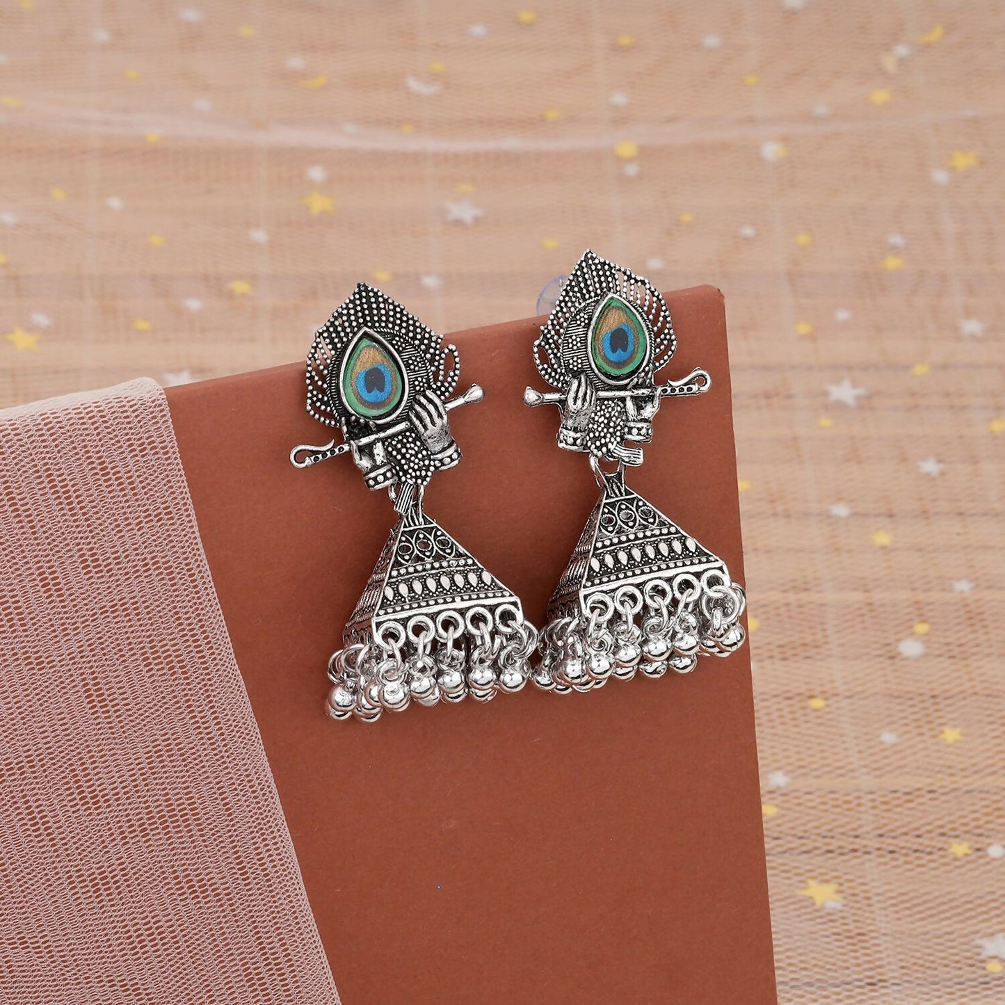 Oxidised silver Krishna jhumka earrings with flute and peacock feather design