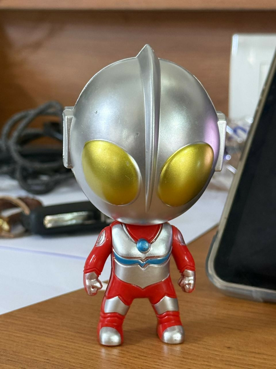 Close-up of mini superhero action figure from capsule toy
