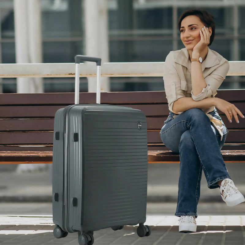 Side view of black 28-Inch hard shell luggage showcasing durable polypropylene surface