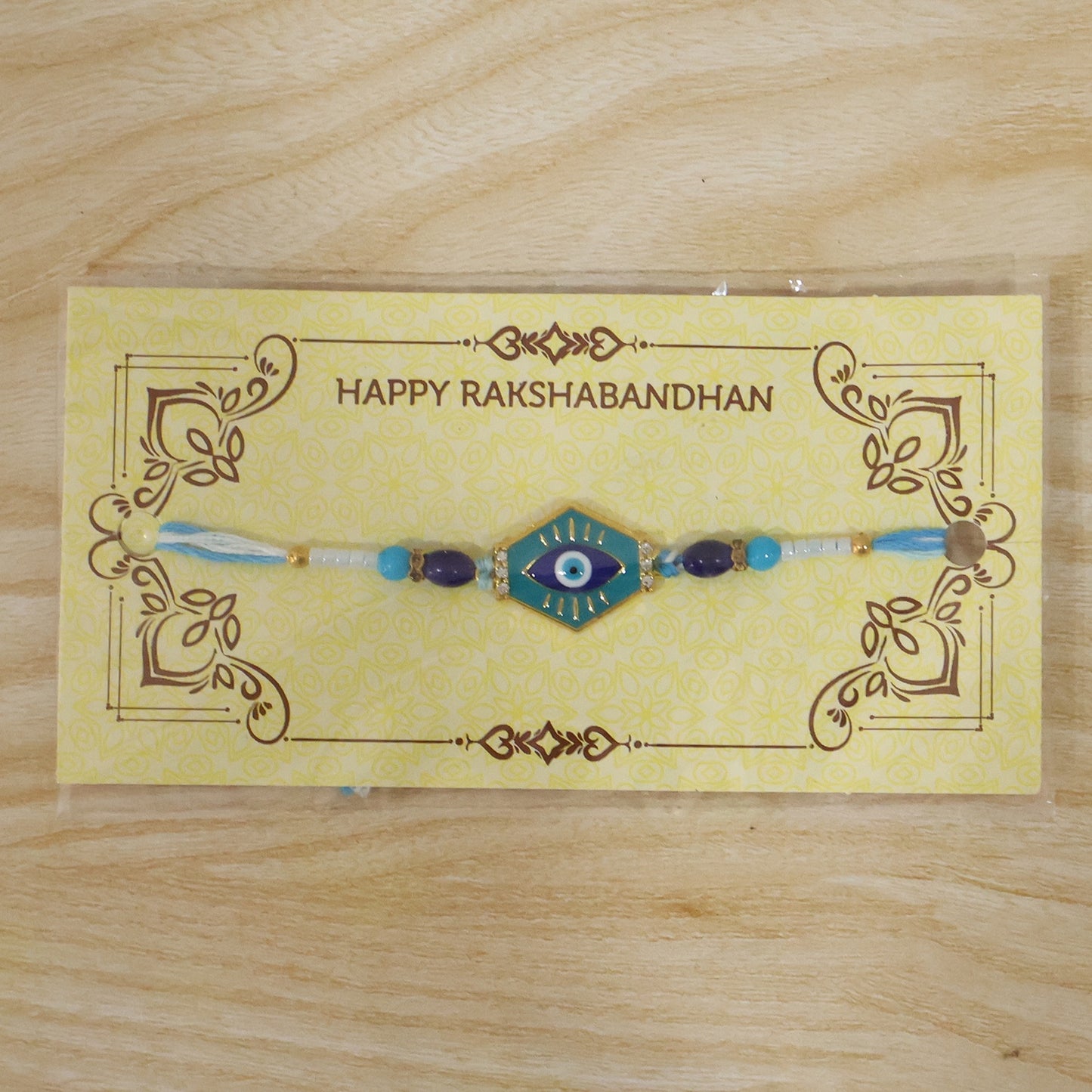 Turquoise evil eye Rakhi tied on wrist