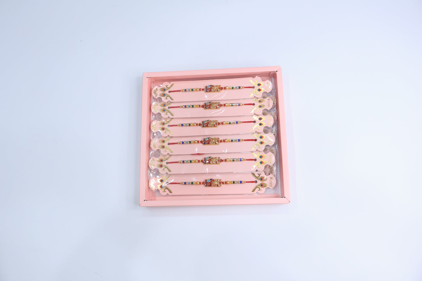 12 Pc Designer Peacock Kundan Rakhi Set with Red Enamel Dial and Multicolor Beads – Premium Traditional Gift Box for Raksha Bandhan