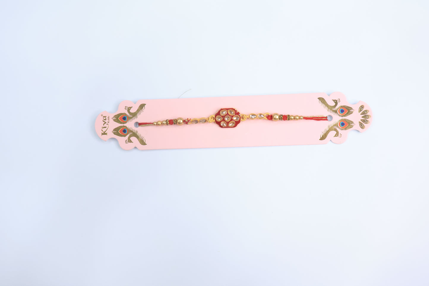 Royal Kundan Rakhi with Red Enamel Centerpiece and Golden Beads – Traditional Designer Rakhi for Raksha Bandhan