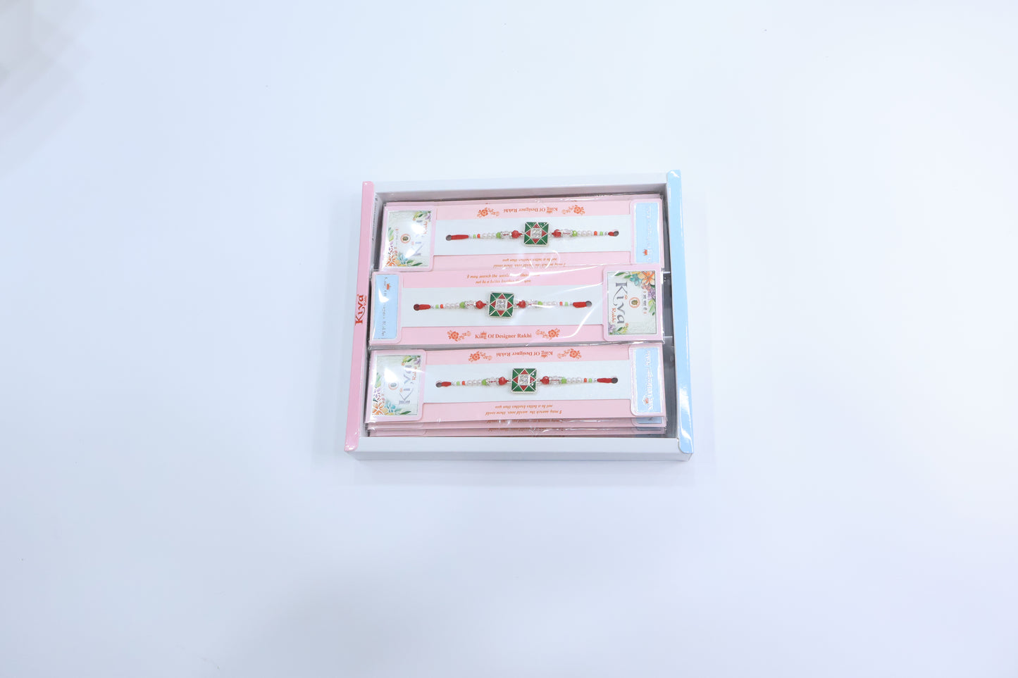 Combo Pack of 12 Green Square Designer Rakhis with Red Accents and Pearl Beaded Threads – Festive Gift Edition